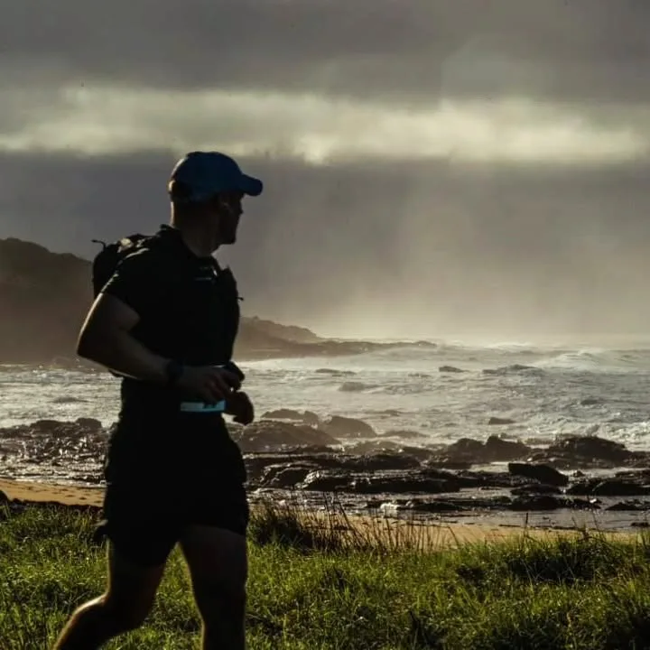 Runner silhouetted at dawn — the active life chiropractic helps you keep